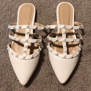 White spiked slide on shoes